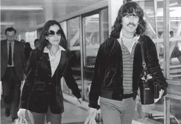  ?? AP ?? The former Olivia Arias and George Harrison at a London airport in 1977. Olivia Harrison recently released a book of poetry.