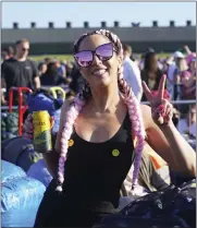  ?? PA VIA AP ?? People queue for entry on the first day of the Glastonbur­y Festival at Worthy Farm in Somerset, England, on Wednesday.