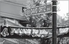  ?? CHARLES KRUPA/AP PHOTO ?? A new “David Ortiz Drive” street sign is posted outside Fenway Park in Boston, after a ceremony where part of Yawkey Way was renamed.