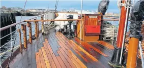  ?? ?? Replacemen­t decking planks at the bows as work goes on to prepare the ship for 2022.