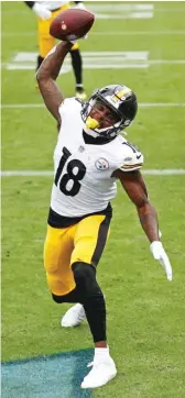  ?? WADE PAYNE/AP ?? Diontae Johnson caught two touchdown passes in the first half as the Steelers built a 24-7 advantage in the battle of unbeaten teams.
