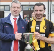  ??  ?? Des Halpenny, Louth County Board Chairman, presents the Paddy Kelly Cup to the Naomh Moninne captain, Andrew McArdle.