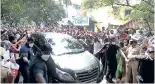  ??  ?? Rajini waves at his fans; supporters gather near Raghavendr­a Kalyana Mandapam