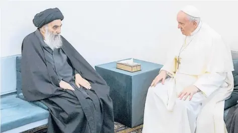  ?? VATICAN MEDIA ?? Pope Francis, right, meets Saturday with Iraq’s leading Shiite cleric, Grand Ayatollah Ali al-Sistani, in Najaf, Iraq. Their meeting at al-Sistani’s home was the first between a pope and a grand ayatollah.