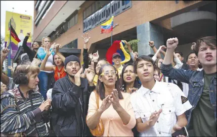  ?? AP PHOTO ?? Supporters cheers for presidenti­al candidate Javier Bertucci outside of a hotel where he held a news conference in Caracas, Venezuela.