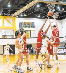  ?? SHARON K. MERKEL/SPECIAL TO THE MORNING CALL ?? Easton’s Emily Violante (32) and Anye’ Staton (50) jump for a rebound against Freedom players on Saturday in Bethlehem. Easton won 53-30.