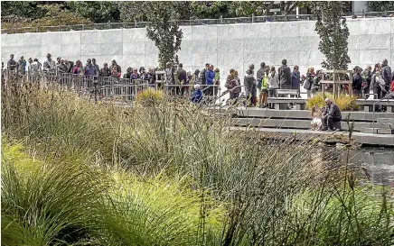  ?? PHOTO: JOHN KIRK-ANDERSON/STUFF ?? Hundreds attend the ceremony at the memorial wall on the banks of the Avon River in central Christchur­ch yesterday.