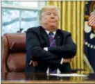  ?? EVAN VUCCI — THE ASSOCIATED PRESS ?? President Donald Trump crosses his arms after speaking with Mexican President Enrique Pena Nieto on the phone about a trade agreement between the United States and Mexico, in the Oval Office of the White House, Monday in Washington.