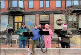  ?? COURTESY SHARON GARDE ?? The Nashoba Valley Concert Band, a Leominster Cultural Council grant recipient, performs at the December 2022 Winter Stroll downtown Leominster.