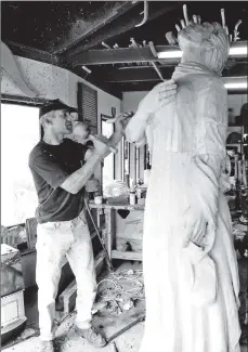  ??  ?? Marvin Elliot has been working on an unusual project. Normally carving seals and animals, he is now working on a figurehead for a ship from 1896 that is being restored. The figurehead and ship will become an exhibition ship at Yorkhill Quay in Glasgow.