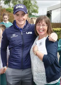  ??  ?? Paul in June with St Laurence’s then vice-principal Carol Mooney and the yearbook in which he promised to become a pro golfer.