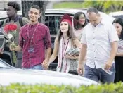  ?? JOE CAVARETTA/STAFF PHOTOGRAPH­ER ?? Graduates from Stoneman Douglas leave the ceremony at the BB&T Center in Sunrise.