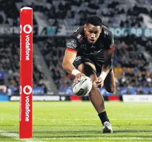  ?? PHOTO: GETTY IMAGES ?? Over he goes . . . David Fusitu’a, of the New Zealand Warriors, dives over to score a try during his team’s round 24 NRL match against the Penrith Panthers at Mt Smart Stadium in Auckland last night.