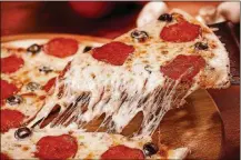  ?? DREAMSTIME/TNS ?? Groupon’s pizza survey found that ordering the small is never worth it for value.