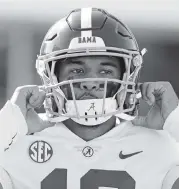  ?? ROGELIO V. SOLIS AP ?? Injured Alabama quarterbac­k Tua Tagovailoa is no longer a lock to be one of the top picks in the 2020 draft.