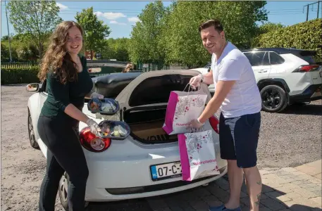  ??  ?? Volunteers of the SVP Food apeal loading their cars up at Ballyseedy Garden Centre with the SVP food for the needed Niamh O’Shea and Stephen White. Photo Joe Hanley