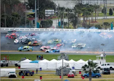  ?? AP/PHELAN M. EBENHACK ?? Drivers navigate a multi-car crash during NASCAR’s Daytona Clash race earlier this month at Daytona Beach Internatio­nal Speedway in Florida.