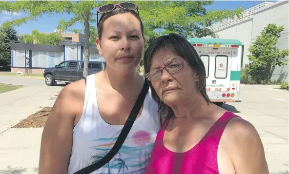  ?? JENNIFER SALTMAN/PNG ?? Heidi Billy, left, and her aunt Ester Spye stand outside the Kamloops Emergency Social Services reception centre where they were forced to flee because of fires. Billy was evacuated from her Cache Creek house and Spye lost her home on the Ashcroft...