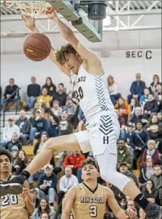  ??  ?? Highlands’ Johnny Crise dunks against Ringgold Saturday in a WPIAL Class 4A quarterfin­al. Highlands defeated Ringgold, 80-56.