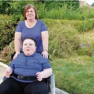  ??  ?? Wheelchair-bound Sheila Johnstone with son Mason in their back garden
010916john­stone_02