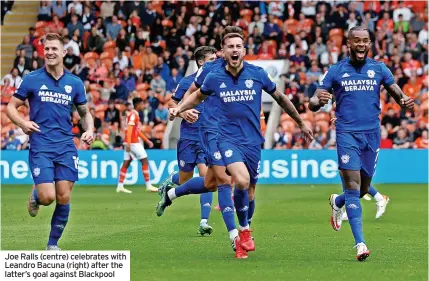  ?? ?? Joe Ralls (centre) celebrates with Leandro Bacuna (right) after the latter’s goal against Blackpool