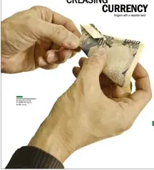  ??  ?? Knowing how to fold it: another fun way to handle money