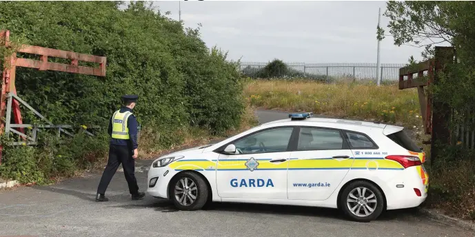  ??  ?? Gardai sealed off the halting site on the Cement Road last Thursday following a shooting.