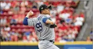  ?? ANDY LYONS / GETTY IMAGES ?? Hyun-Jin Ryu held the Reds to five hits in seven scoreless innings Sunday at Great American Ball Park in Cincinnati. Ryu improved to 6-1 this season and lowered his ERA to a spiffy 1.52.