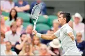  ?? PTI ?? Serbia's Novak Djokovic volleys a return to Korea's Kwon Soonwoo in a men's first round singles match on day one of the Wimbledon tennis championsh­ips in London, Monday
