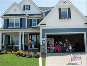  ?? NEWS-HERALD FILE ?? Visitors tour the 2018 Lake County YMCA Dream House located at 5360 Highland Way in Mentor on opening day.