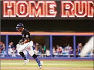  ?? Frank Franklin II / Associated Press ?? The New York Mets’ Francisco Lindor celebrates as he runs the bases after hitting a three-run home run during the first inning against the Miami Marlins on Friday.