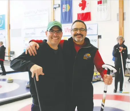  ?? MARIE CONBOY ?? Scott Ouellette, left, from near Drumheller, and Mitch Pattyn, of Calgary, are both heart transplant recipients. Their curling squad won gold for Canada at the World Transplant Winter Games in Banff on Wednesday. They see the Games as a way to celebrate their new lease on life.