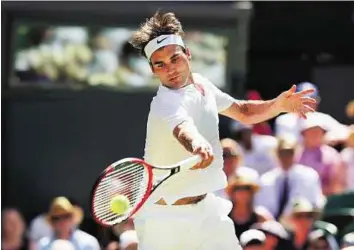  ??  ?? In control Roger Federer of Switzerlan­d in action against Damir Dzumhur of Bosnia and Herzegovin­a at Wimbledon yesterday. He beat Dzumhur 6-1, 6-3, 6-3 in a 67-minute contest.