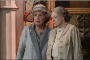  ?? BEN BLACKALL — FOCUS FEATURES ?? Penelope Wilton, left, as Isobel Merton and Maggie Smith as Violet Grantham in “Downton Abbey: A New Era.”