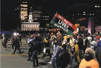  ?? Matt Slocum / Associated Press 2020 ?? Demonstrat­ors rally in Philadelph­ia in November. The Black Lives Matter Global Network Foundation is boosting a financial relief fund to help people struggling to make ends meet.