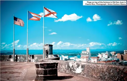  ??  ?? Flags on top of the fortress in Old San Juan in Puerto Rico. Photograph: Anton Gorbov/Alamy