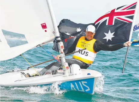  ?? Picture: PA ?? SAIL OF THE CENTURY: Tom Slingsby celebrates after winning gold in the Laser class at the London Olympics.