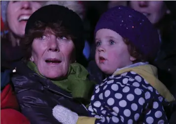  ??  ?? Maura Mowatt and Summer Smullen waiting for Santa to arrive at the switching on the Christmas lights at Bray Civic Plaza.