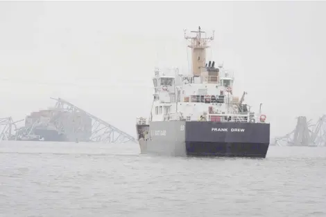  ?? — AFP photo ?? The US Coast Guard working at the scene after the cargo ship Dali collided with the Francis Scott Key Bridge causing it to collapse.