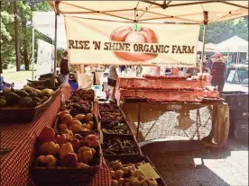  ?? / Alexis Draut ?? Rise ‘N Shine organic farm sells its goods at the Freedom Farmers Market at the Carter Center in Atlanta.