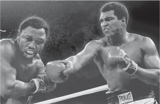  ?? AP ?? Among the things Couch Slouch misses about the 20th century are big heavyweigh­t title fights, such as this 1975 bout between Muhammad Ali and Joe Frazier.