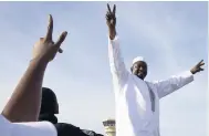 ?? AP ?? In this Thursday, January 26, 2017, file photo, Gambian President Adama Barrow greets the crowds after arriving at Banjul airport in Gambia.
