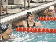  ?? Gregory Vasil / For Hearst Connecticu­t Media ?? Darien’s Lexi Punishill reacts after winning the 100-yard freestyle during the FCIAC championsh­ip in November.