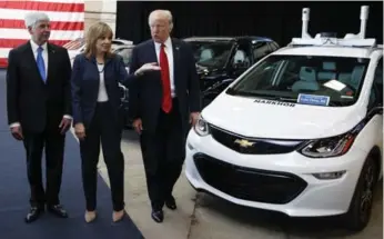  ?? EVAN VUCCI/THE ASSOCIATED PRESS ?? U.S. President Donald Trump tours the American Center of Mobility on Wednesday in Ypsilanti, Mich.