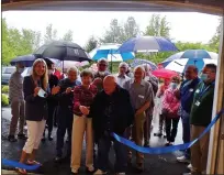  ?? BOB KEELER — MEDIANEWS GROUP ?? Ruth and Mike Taylor, center, cut the ribbon while standing outside the new Taylor Woodshop in the Peter Becker Community Center.