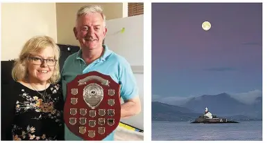  ?? RIGHT: ?? Castleisla­nd man John Keane pictured with Nikki Foley as he collected the 2019 Killarney Camera Club Photograph­er of the Year award. The 2020 presentati­on has been postponed for the duration of the current restrictio­ns. the Fenit photograph he waited so long for.