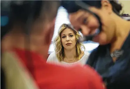  ?? Mark Mulligan / Houston Chronicle ?? “Danielle, Nick’s got a long road ahead of him,” his father told her. “There ain’t nobody gonna be mad at you if you decide to stay in Baton Rouge.” But she’s stayed by her fiancé’s side through the initial aftermath of the shooting and therapy in Houston.