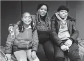  ?? ERIN SCHAFF/THE NEW YORK TIMES ?? Kemika Cosey with her children, Zurie, left, and Zamir, students at Garrison Elementary School in Washington, D.C., on Tuesday.