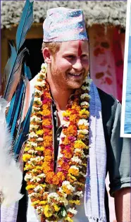  ??  ?? March 2016: A traditiona­l Nepalese topi hat and garlands