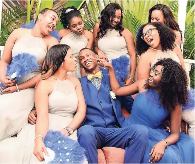  ??  ?? The groom is surrounded by a sea of beauties. From left: Yanique Chin, Kherissa Myers, Kereisha McLeod, Tanesha Stewart, Kimberly Morrison, Elony Perry-Ryan, and Monique Gobern.